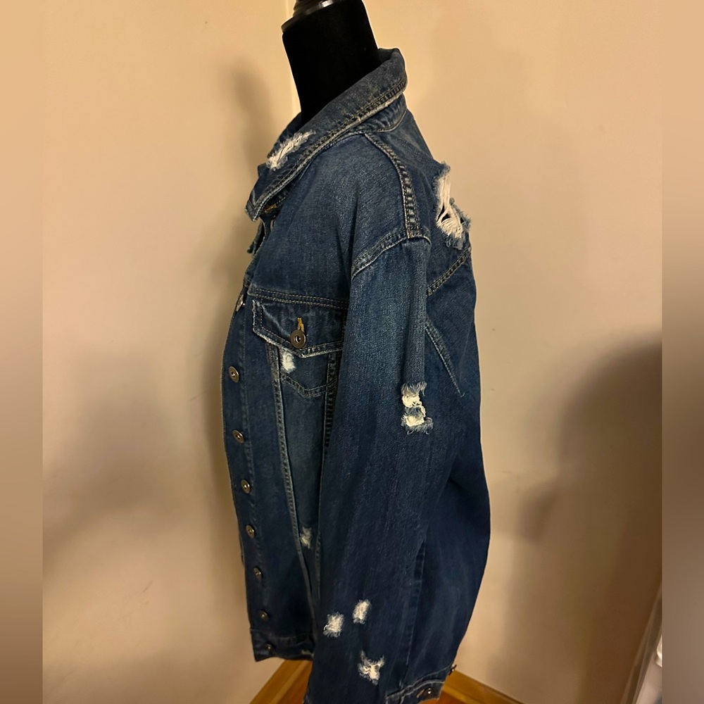 Distressed medium dark blue jean waist length jacket